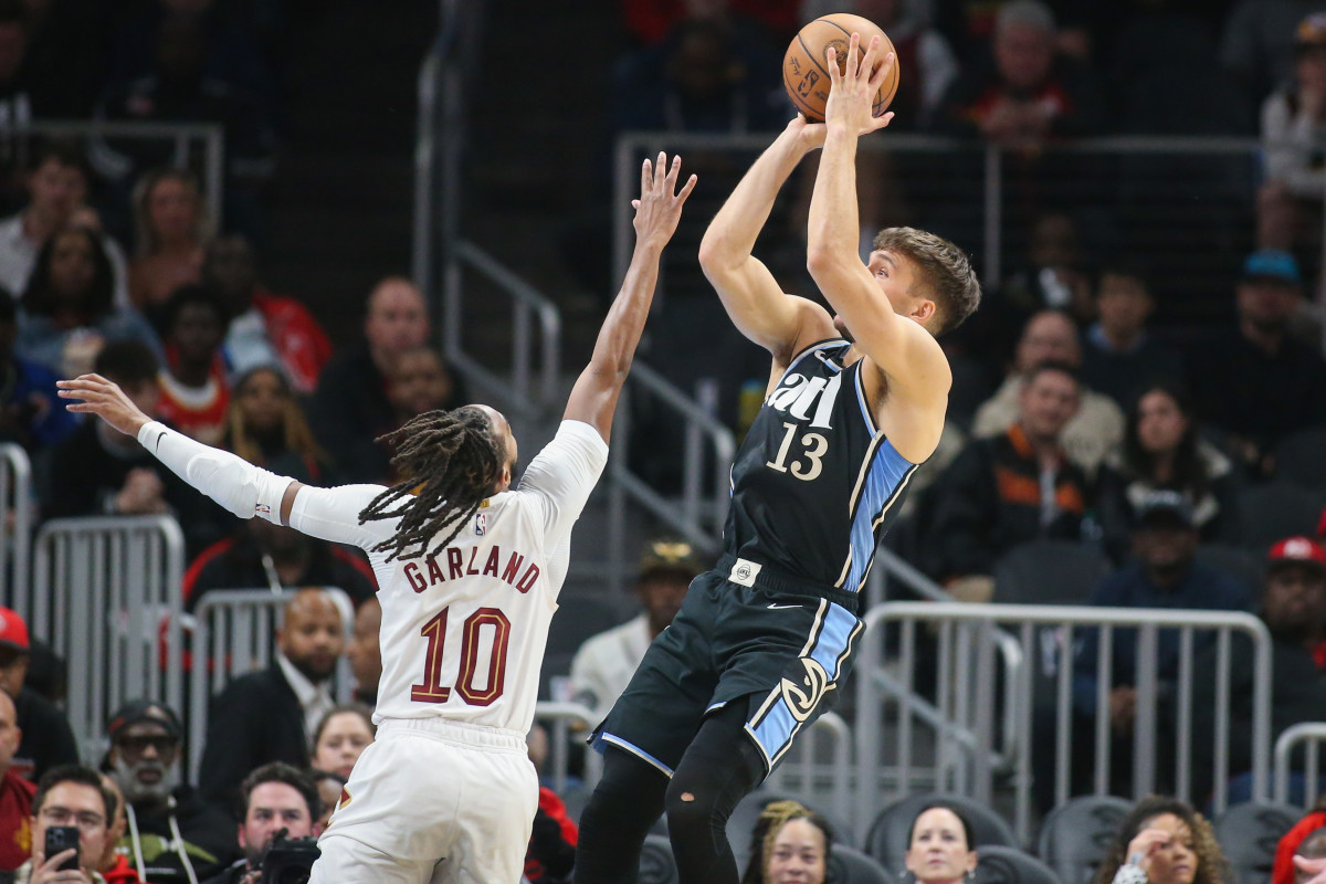 Mar 6, 2024; Atlanta, Georgia, USA; Atlanta Hawks guard Bogdan Bogdanovic (13) shoots over Cleveland Cavaliers guard Darius Garland (10) in the first quarter at State Farm Arena. Mandatory Credit: Brett Davis-USA TODAY Sports